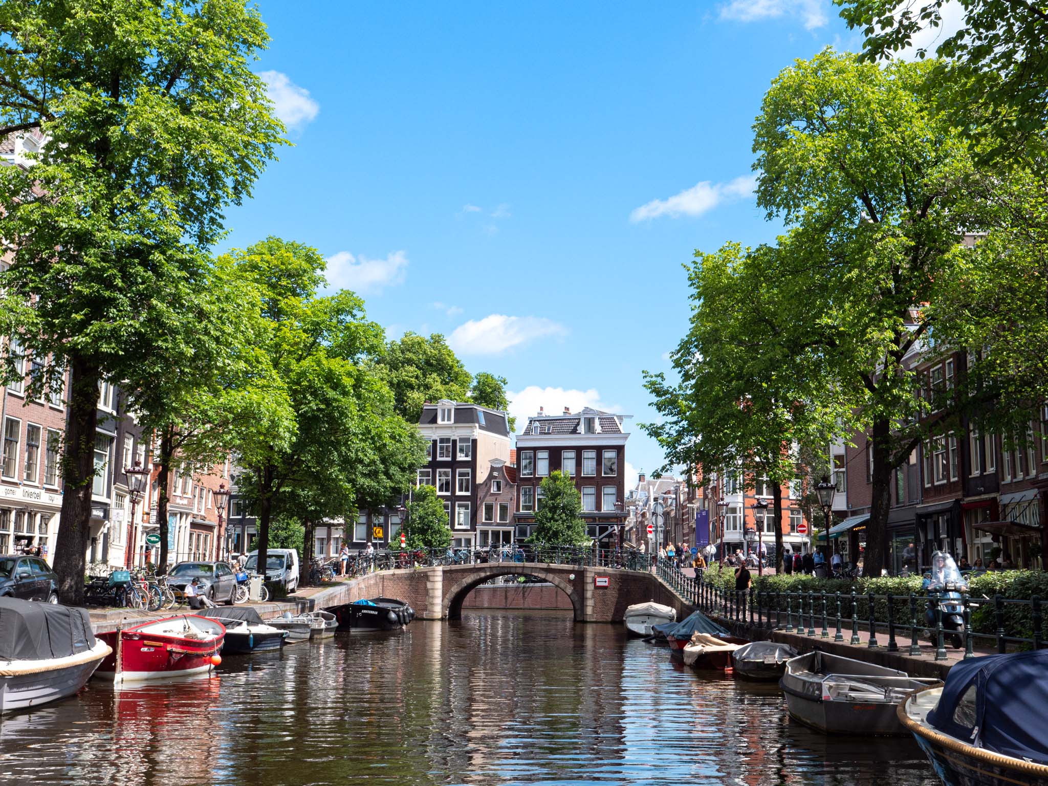a canal with boats and buildings on the side