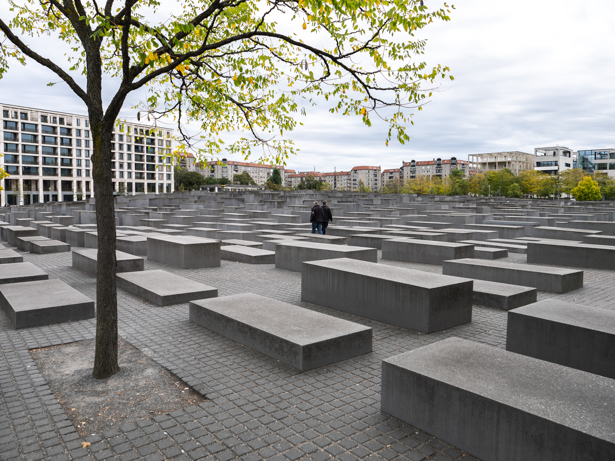 a group of people standing in a large stone area