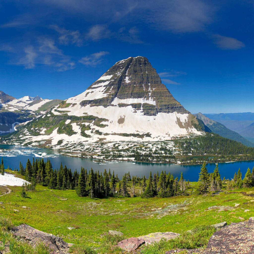 a mountain with a lake and trees