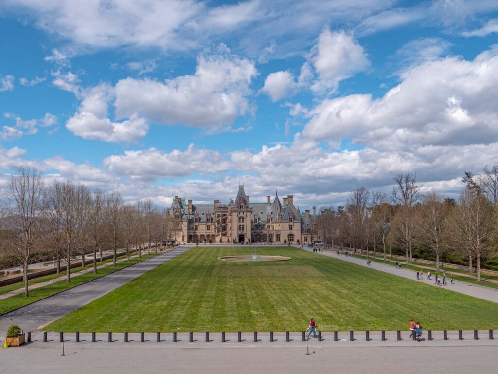 a large lawn with people walking on it