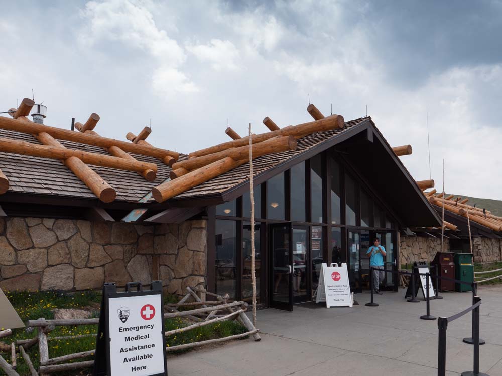 a building with logs on the roof