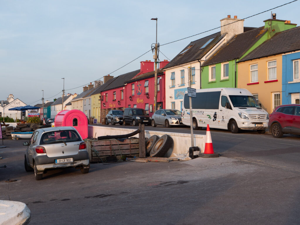 Colorful buildings with cars in the foreground