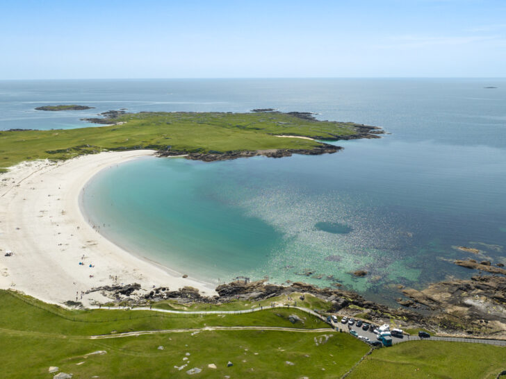 Dog's Bay Beach Ireland, vibrant green grass, white sand beach and turquoise water