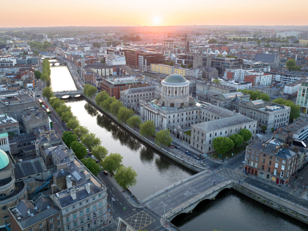 Aerial image of Dublin, Ireland during sunset with a river cutting down the center