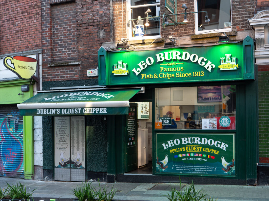 Fish and chips restaurant with a green sign