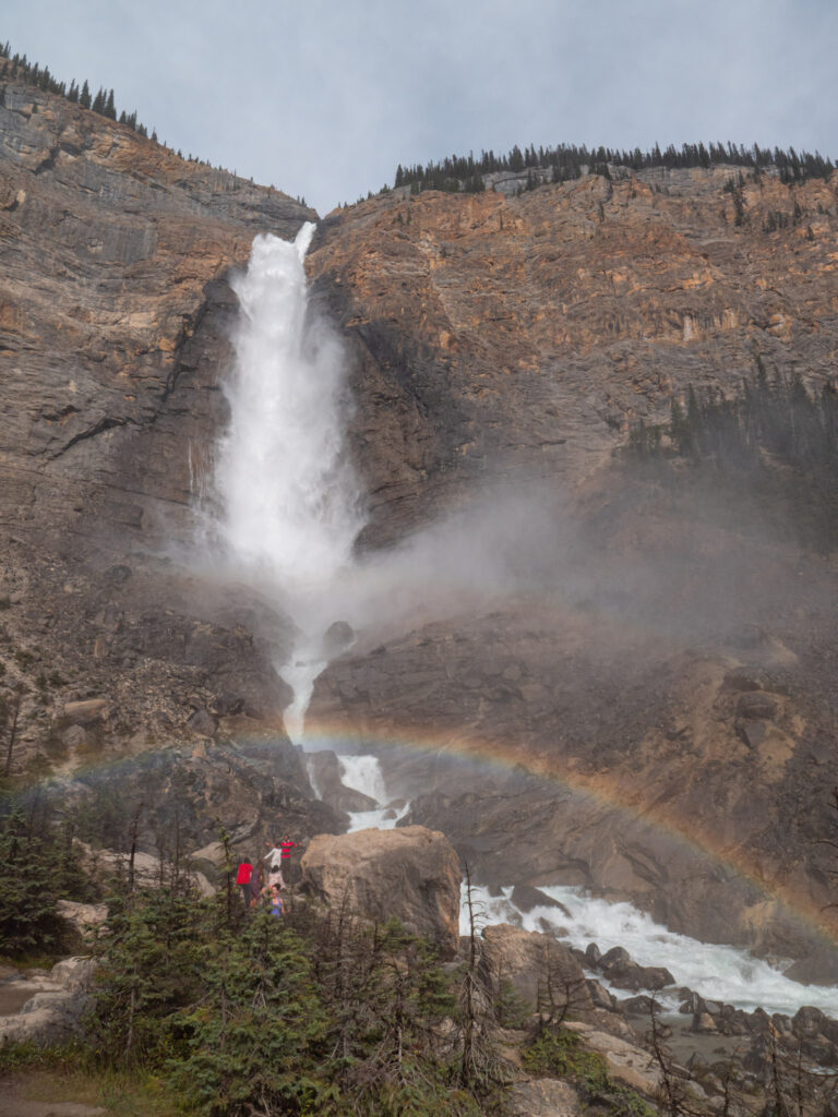 People posing at Takakkaw Falls, British Columbia
