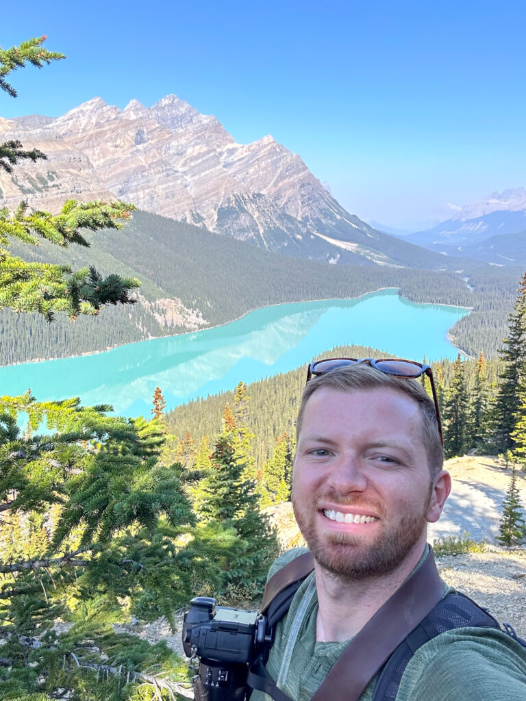 Man taking selfie at Peyto Lake Alberta, Canada