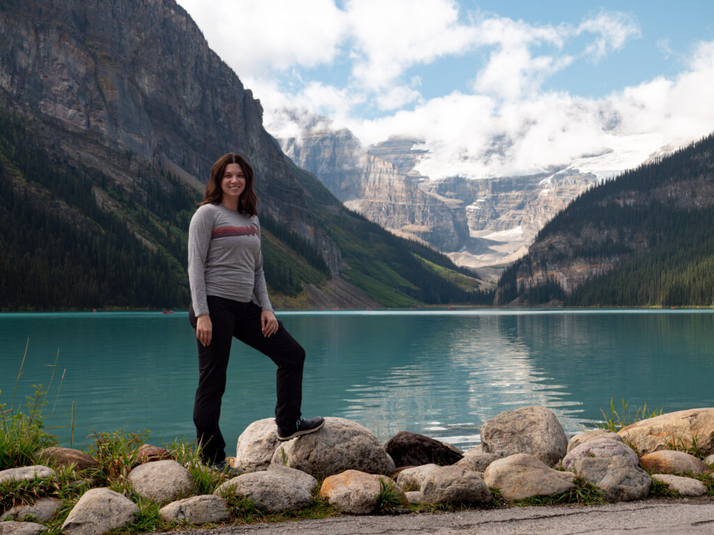 Woman posing for a photograph at Lake Louise in Banff National Park