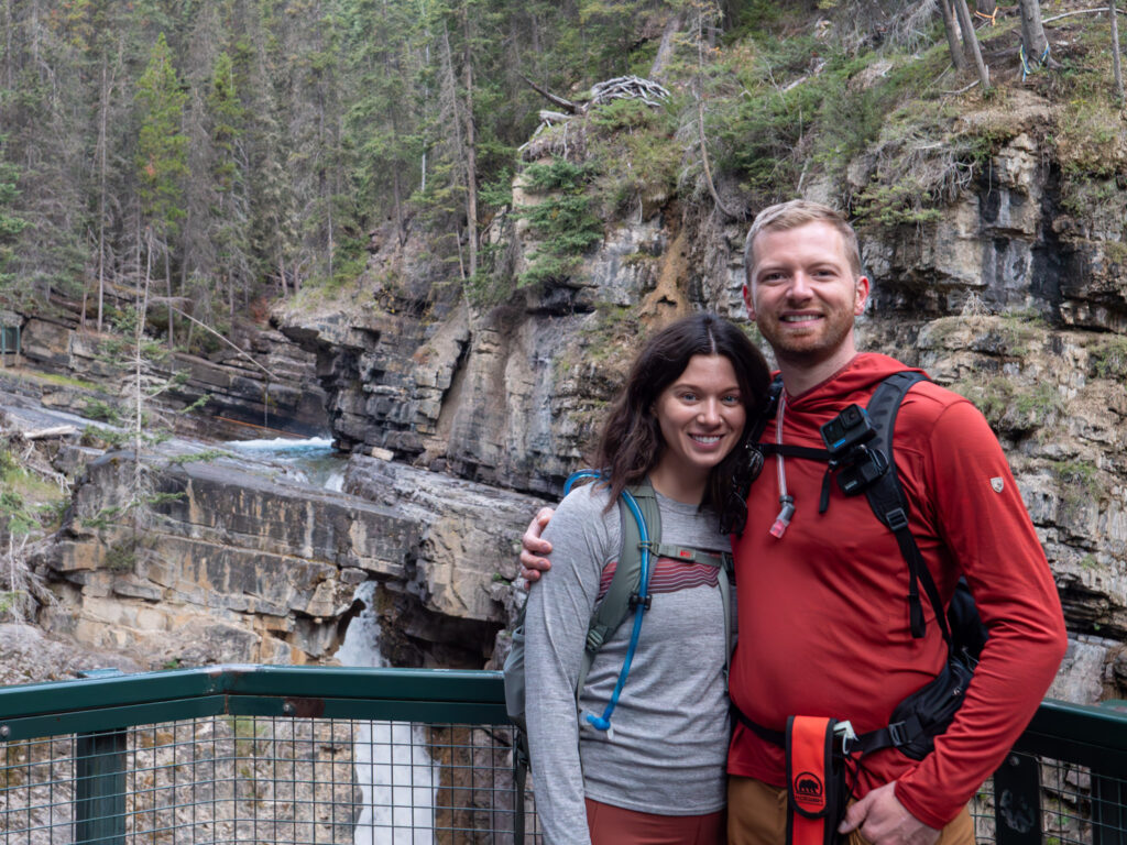 Couple posing near Johnston Canyon Upper Falls Banff Canada