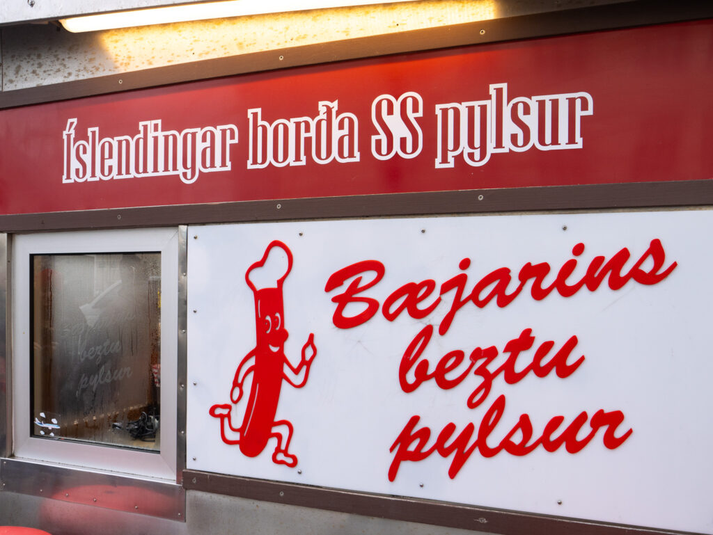 The iconic Baejarins Beztu Pylsur hot dog sign in red and white