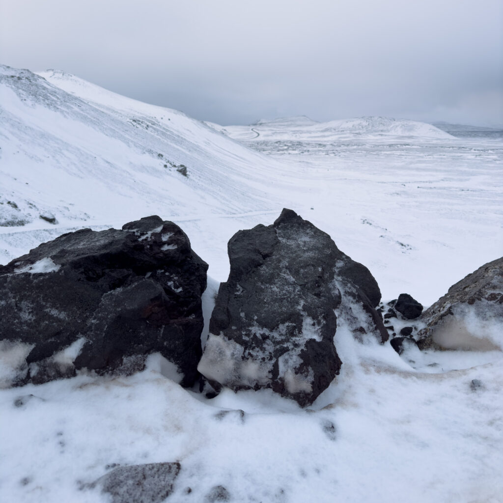 Rocky terrain covered in snow during a winter Iceland hike