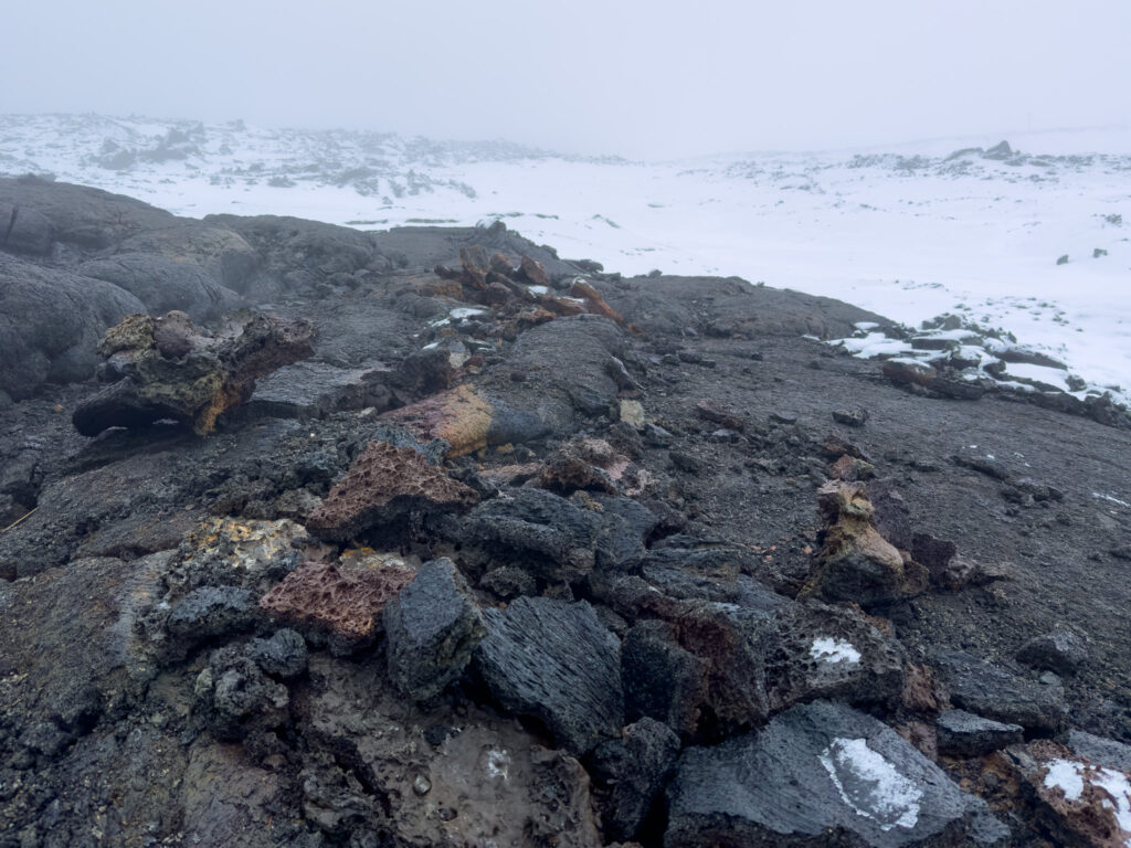 Colorful volcanic rocks sitting in a lava field near Grindavik Iceland