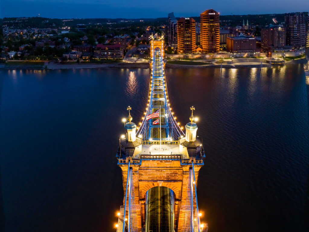 Aerial image of the Roebling Bridge lit up at night