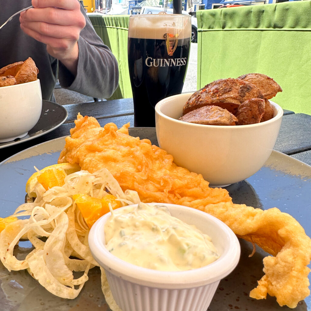 Fish and chips with a glass of Guinness beer