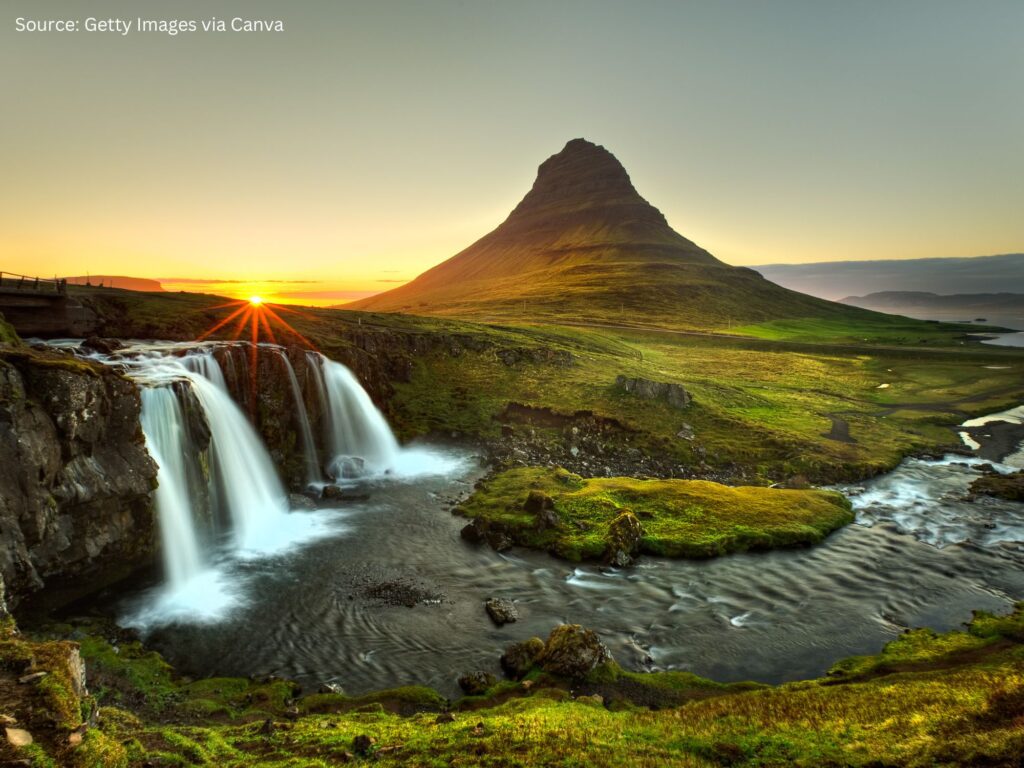 a waterfall and a mountain