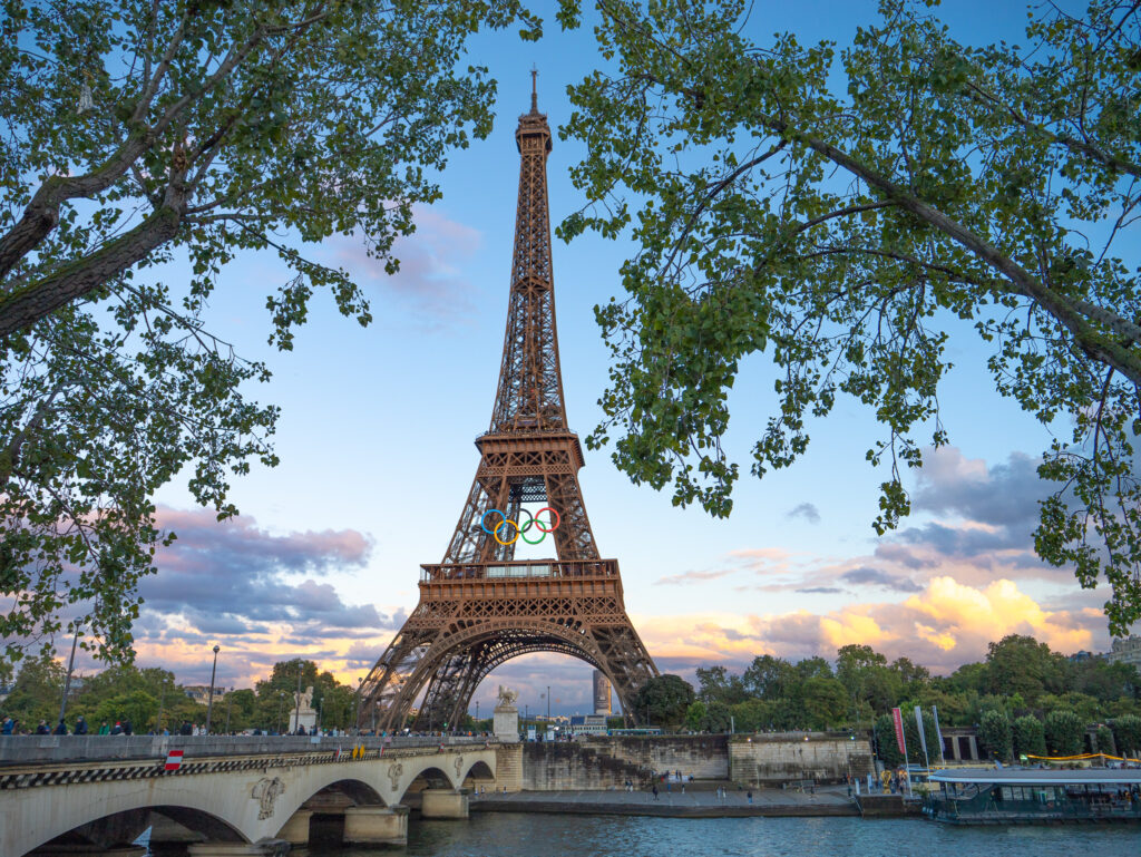 a eiffel tower with a bridge and trees