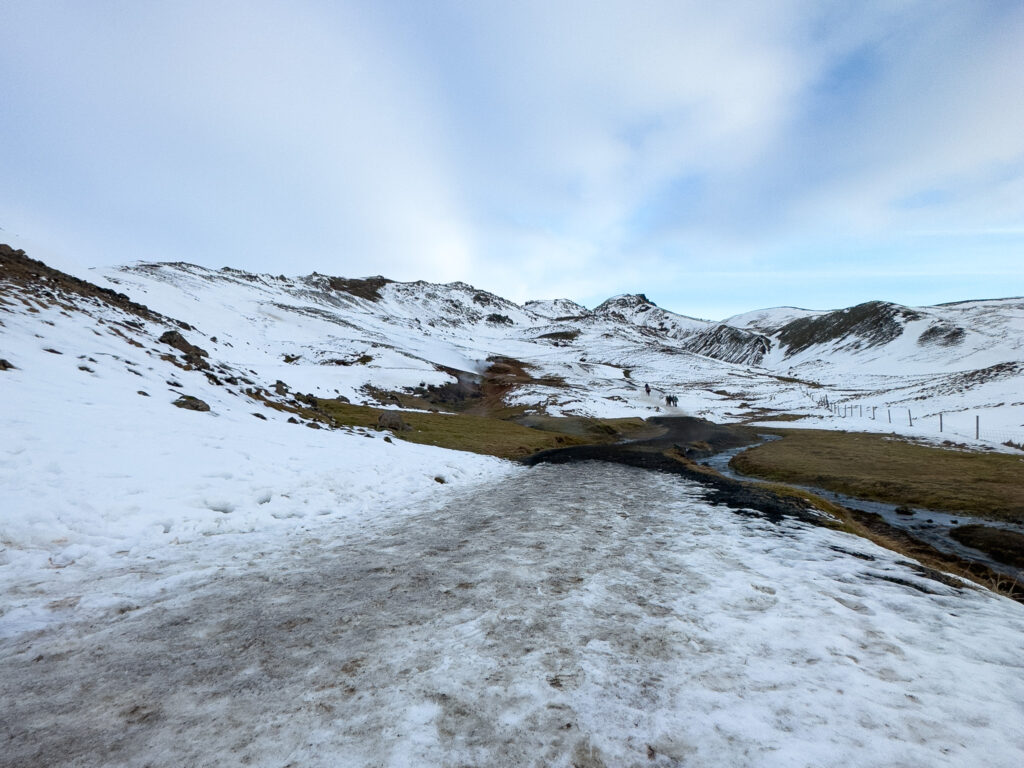 a snowy mountain with a road