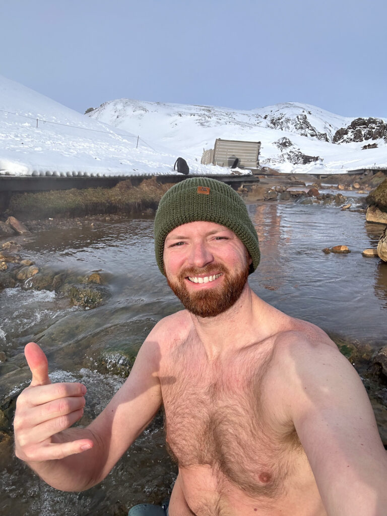a man in a hat and a hat in a river